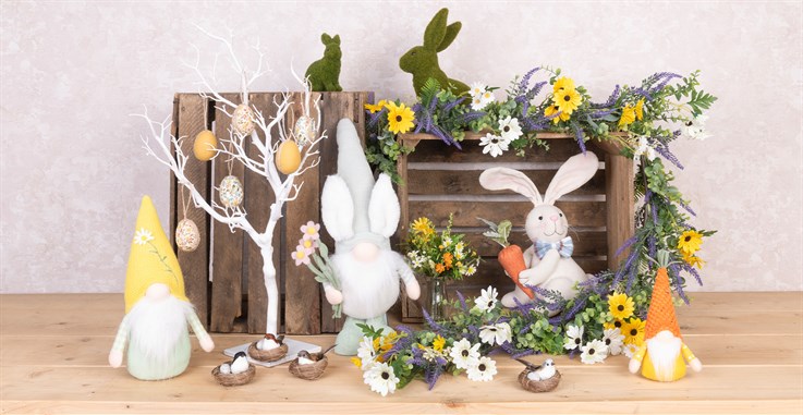 springtime gonks, fabric egg hangers, moss rabbits and flowers in a spring display
