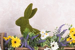 moss covered bunny decoration with spring flower garland