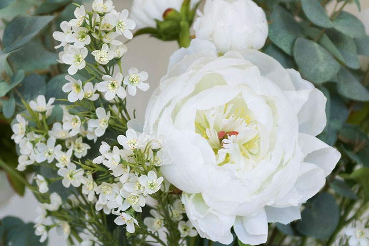 close up of white artificial flowers