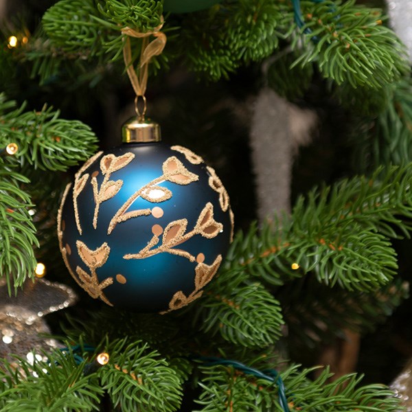 blue and gold bauble hanging from christmas tree