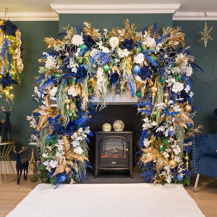 blue, white and gold christmas fireplace display