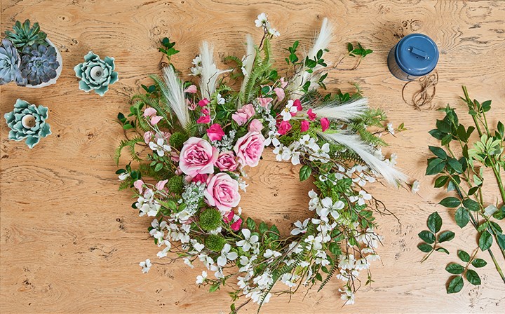 handmade floral wreath with stems, twine and plants