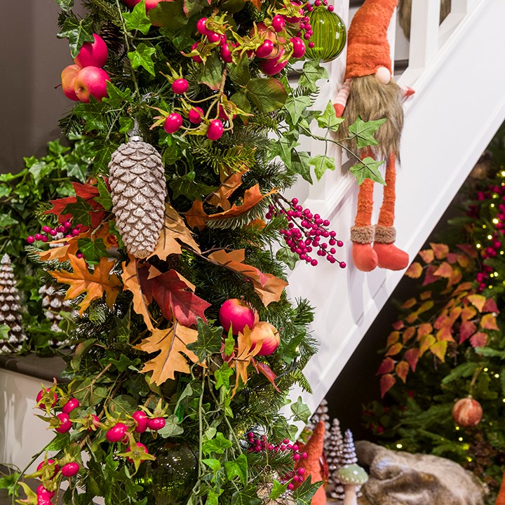 autumn staircase display with garland, faux fruit, pinecones and gonk