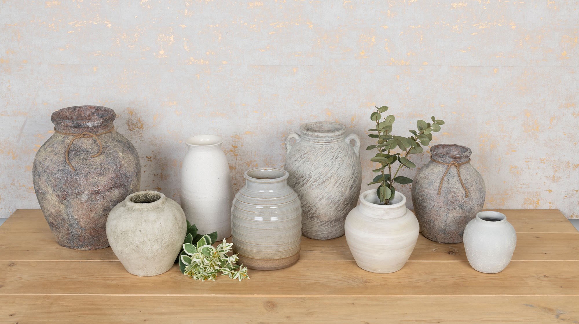 collection of ceramic vases and stems