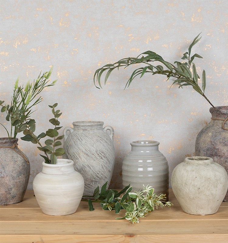 collection of ceramic vases and stems