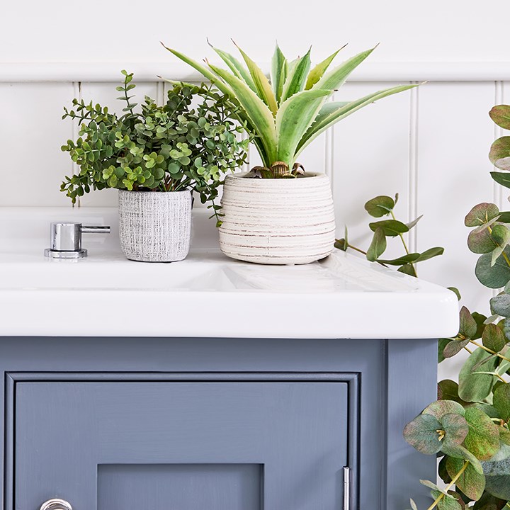 artificial potted green plants in bathroom