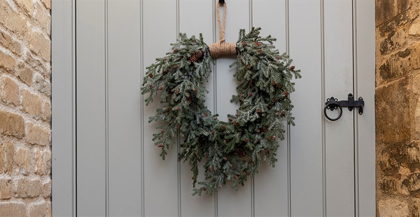 Christmas wreath hung on outside door