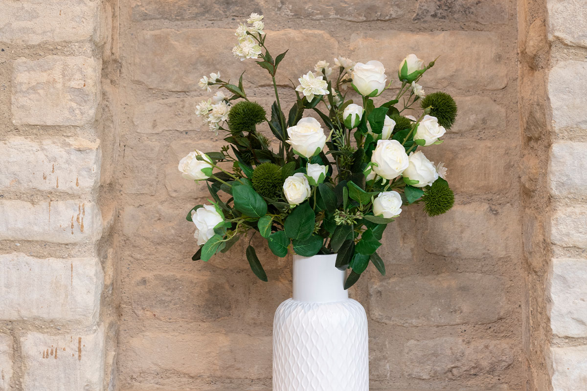 white artificial roses in vase
