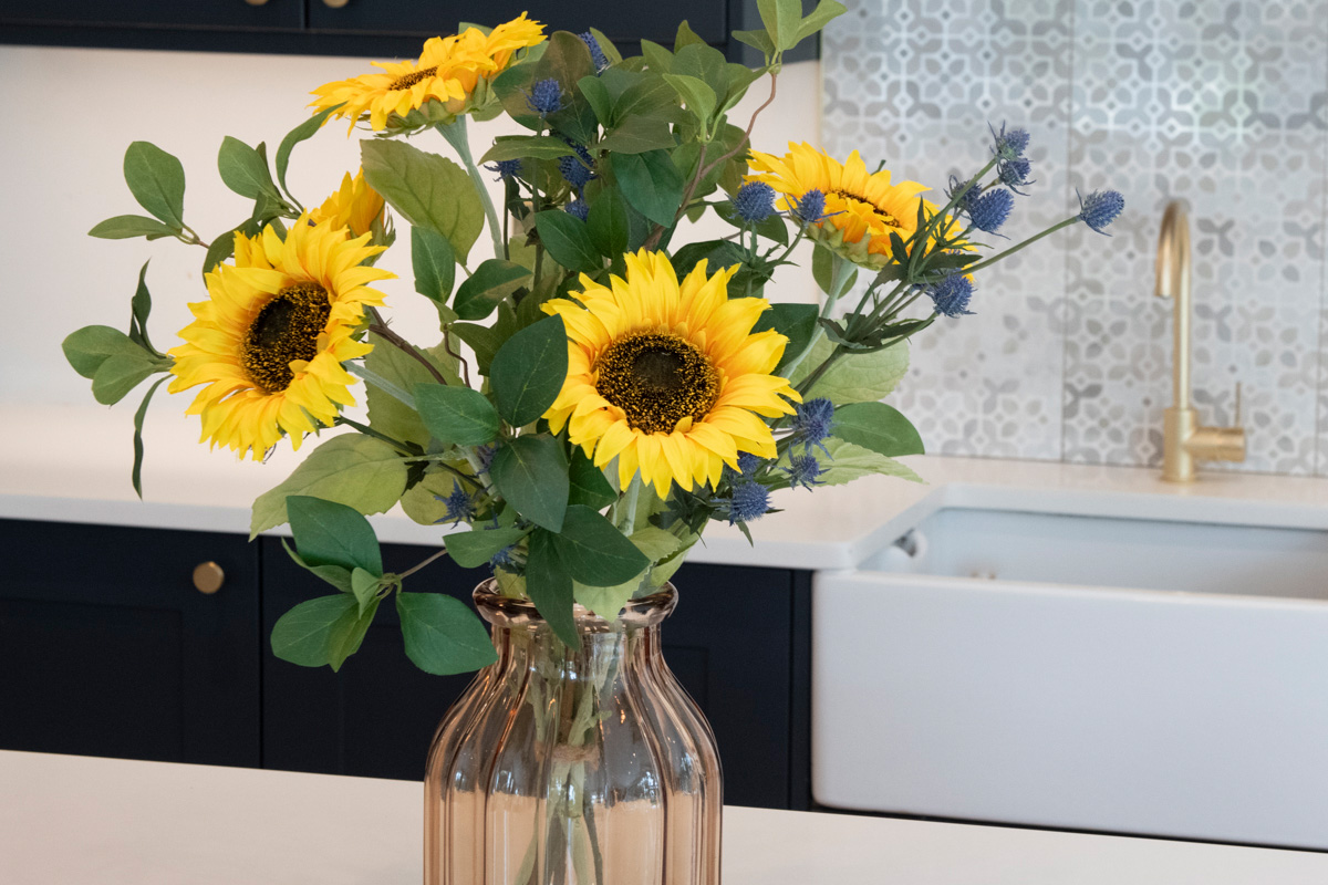 faux sunflowers in vase