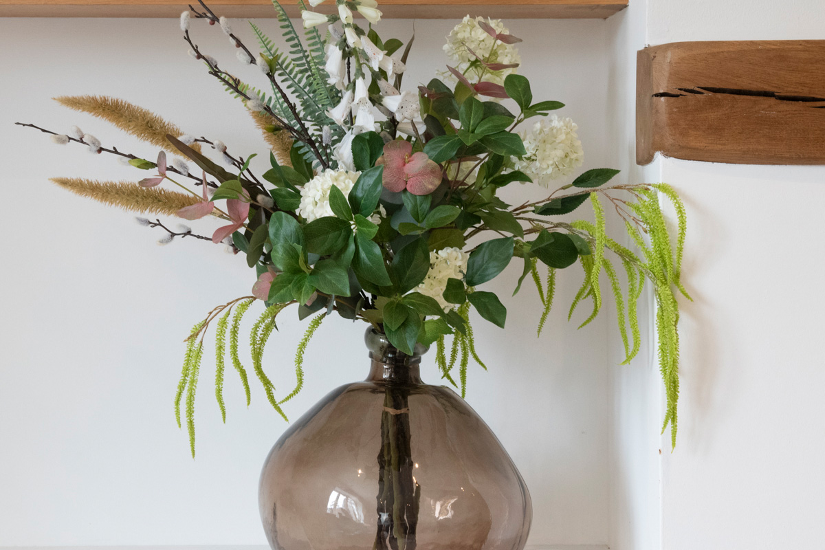 artificial foliage arranged in vase